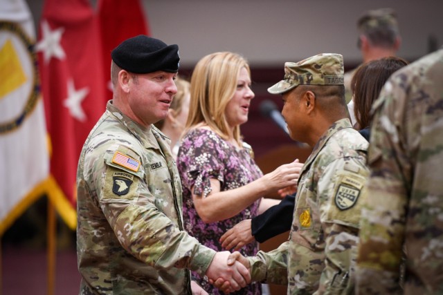 CAMP HUMPHREYS, Republic of Korea - Col. Michael F. Tremblay, the outgoing garrison commander for United States Army Garrison Humphreys, shakes hands with Command Sgt. Maj. Walter A. Tagalicud, the senior enlisted advisor for Eighth Army, after his change of command ceremony here, June 15. During the ceremony, Tremblay formally handed off command of the garrison to Col. Seth C. Graves, marking the end of Tremblay&#39;s two-year leadership at Humphreys.