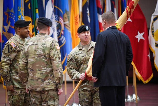 CAMP HUMPHREYS, Republic of Korea - Col. Michael F. Tremblay, the outgoing garrison commander for United States Army Garrison Humphreys, passes the guidon to Mr. Craig Deatrick, the Installation Management Command-Pacific Director, formally signifying the end of his command here, June 15, during a change of command ceremony. Tremblay&#39;s dedication and leadership helped direct Humphreys through the COVID-19 pandemic, incorporating messaging, community building, and the establishment of effective medical facilities to mitigate the negative effects of the pandemic. 