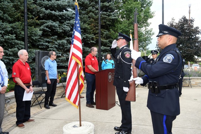 The Buffalo Grove honor guard detail, made up of police officers and fire-fighters from Buffalo Grove, render a salute during a presentation of Colors at the Village of Buffalo Grove annual Flag Day commemoration, June 14, 2021. Army Reserve Lt....
