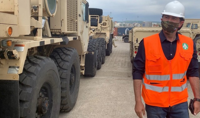 Michael Pittas, Terminal Manager (US Army), Transportation Corps, Eastern Mediterranean Detachment (Greece), supervises the vessel discharge and initial staging operations of U.S. Army equipment at the port in Alexandroupoli, Greece.