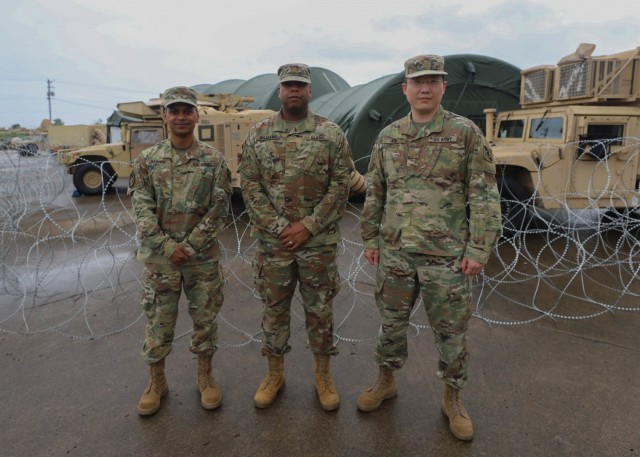 U.S. Army Reserve Soldiers Maj. Mohammed Rashed (left), Maj. Geoffrey Williams (middle), and Major Wonny Kim (right) stand at the site of the V Corps Defender Europe 21 command post exercise June 11, 2021 at Fort Knox, Kentucky. The three Reserve Officers from the 75th Innovation Command supported V Corps and their missions by providing AI technology to maintain V Corps mission ready standards. (U.S. Army photo by PV2 Klecan)
