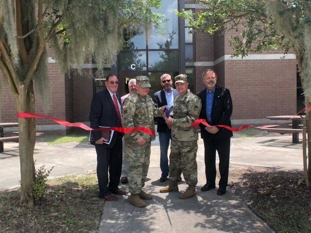 Acting Assistant Secretary of the Army (Installations, Environment & Energy), Mr. Jack Surash (Left), along with members of the Fort Stewart-Hunter Army Airfield Garrison command team and DPW leadership, participate in a ribbon cutting ceremony at...