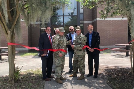 Acting Assistant Secretary of the Army (Installations, Environment & Energy), Mr. Jack Surash (Left), along with members of the Fort Stewart-Hunter Army Airfield Garrison command team and DPW leadership, participate in a ribbon cutting ceremony at the newly renovated 1st Armored Brigade Combat Team’s barracks complex, which were renovated prior to the unit’s redeployment.