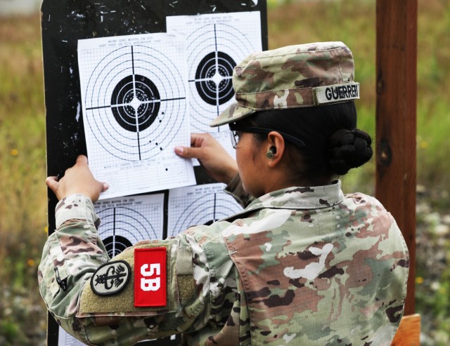 Sgt. Sofia Guerrero, assigned to Brian D. Allgood Army Community Hospital, Camp Humphreys, South Korea, checks her target on the M-4 carbine zero range during the Regional Health Command-Pacific Best Leader Competition at Joint Base Lewis-McChord,...