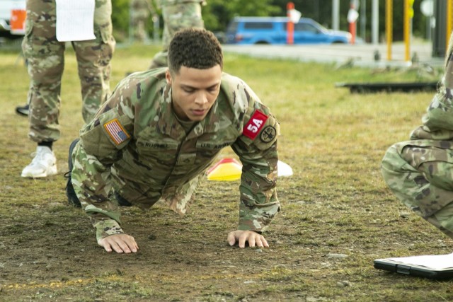 Pfc. DeShawn Russell, a behavioral health specialist assigned to U.S. Army Medical Department Activity - Korea, executes a set of hand-release pushups during the Army Combat Fitness Test, as part of the Regional Health Command - Pacific best leader competition, at Joint Base Lewis-McChord, Wash., June 16, 2021. The second full day of this four-day challenge also included land navigation exercises in addition to constructing individual fighting positions. (U.S. Army photo by Spc. Richard Carlisi, I Corps Public Affairs)