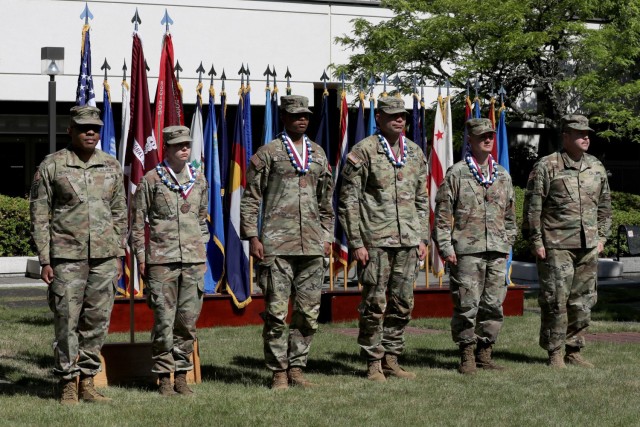 The third place team consisted of Spc. Carin Hemshorn, Sgt. Phadrian Burnett, Master Sgt. Andrew Ruff, and 1st Lt. Daniel Stephens of Madigan Army Medical Center. The MAMC team is seen here with Command Sgt. Maj. Abuoh Neufville, far left, and...