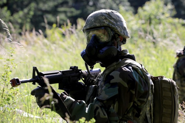 A Soldier watches for contact during a security halt during the Regional Health Command-Pacific Best Leader Competition, Joint Base Lewis-McChord, Wash., June 17, 2021. The Best Leader Competition promotes esprit de corps across the Army, while...