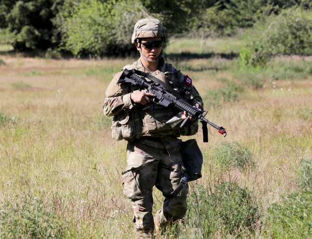 First Lt. Samuel Joo, an Army nurse assigned to U.S. Medical Department Activity-Korea, moves toward Army Warrior Tasks lanes during the Regional Health Command-Pacific Best Leader Competition, Joint Base Lewis-McChord, Wash., June 17, 2021. The...