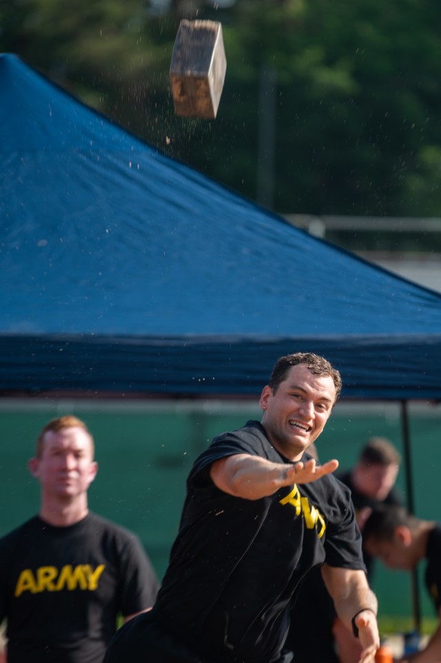 Capt. Jonathan Kuhlman, a JAG with the 21st Theater Sustainment Command, throws a stone during a German Sports Badge event on Panzer Kaserne, Germany, June 19, 2021.