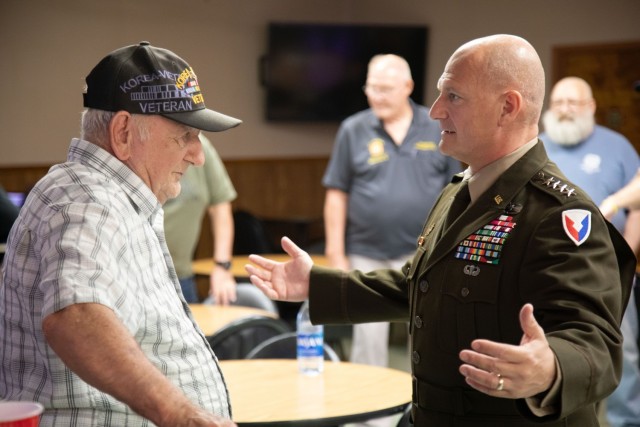 Gen. Ed Daly, commander Army Materiel Command, talks with Korean War veteran Pat Liddy during his visit to the Veterans of Foreign Wars Post 3377 in Manchaca, Texas June 12.