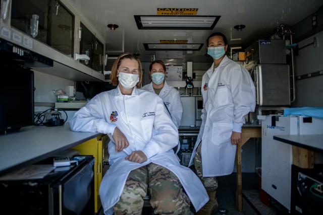 Three members of the laboratory covid testing team (left) Capt. Fawn OLeary, Medical Service Officer, (middle) Capt. Shawna So, Chemical Officer and (right) Maj. Brooke Spridgen, Lab Officer, assigned to 773rd Civil Support Team, 7th Mission...