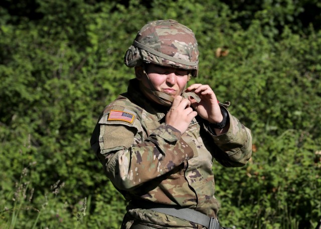 First Lt. Sarah Davis, an Army nurse assigned to Tripler Army Medical Center, Honolulu, snaps on her helmet during the Regional Health Command-Pacific Best Leader Competition, Joint Base Lewis-McChord, Wash., June 17, 2021. The Best Leader...