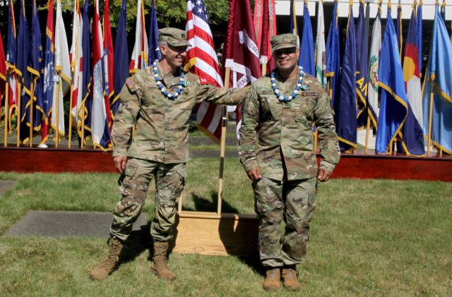 Capt. Jason Christman, left, congratulates his teammate, Staff Sgt. Israel Rivera, on their top finish in the Regional Health Command-Pacific Best Leader Competition, June 18, 2021. Both are assigned to Desmond Doss Army Health Clinic. The two are...