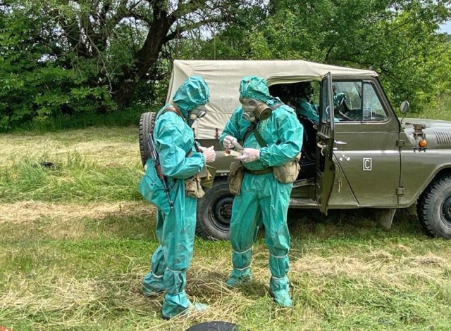 Soldiers from the Bulgarian Army's 38th Chemical, Biological, Radiological, Nuclear Defence Battalion open chemical sampling kits while suited up in protective gear to demonstrate CBRN reaction procedures during a military-to-military exchange held with U.S. Army Reserve Soldiers from the 773rd Civil Support Team, 7th Mission Support Command, in Sofia, Bulgaria, May 25-28, 2021. The event was designed to enhance relationships and interoperability with Allies and partner nations. (U.S. Army Reserve photo by Staff Sgt. Rosannie Murillo, 773rd CST)