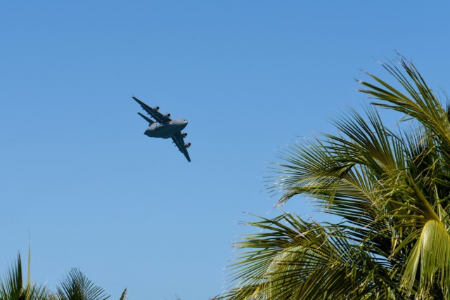 A C-17 Globemaster III, piloted by members of the C-17 West Coast Demo Team from Joint Base Lewis-McChord, Washington, flies through the skies above Miami Beach, Florida, May 29, 2021. The demonstration was a part of the National Salute to Our...