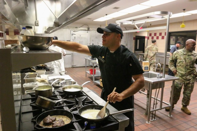 SPC Edwin Alvarado, STB, DSB, 101st Airborne Division (AASLT), prepares his entree for the annual culinary competition which is held during the Week of the Eagles. This competition gives Soldiers from all career fields the chance to show off their...