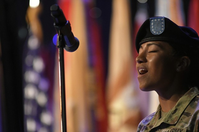 Pvt. Kelice Hines, a U.S. Army Quartermaster School advanced individual training student, belts out the national anthemn during a 23rd QM Brigade change of command ceremony June 23rd at the Lee Theater. Hines is a Brooklyn native.
