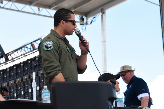 U.S. Air Force Maj. Mack Delgado, C-17 West Coast Demo Team pilot, announces and narrates during the C-17 Globemaster III demonstration at the National Salute to Our Heroes Hyundai Air and Sea Show in Miami Beach, Florida, May 30, 2021. The C-17 West Coast Demo Team, based out of Joint Base Lewis-McChord, Washington, showcases the abilities of the C-17 Globemaster III to the public, providing an opportunity for community engagement and recruitment. (U.S. Air Force photo by Senior Airman Mikayla Heineck)