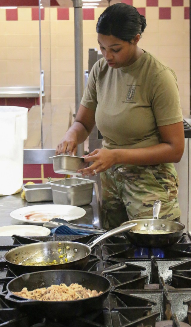SSG Harlei May, 52nd EOD, Division Artillery, 101st Airborne Division (AASLT), begins plating her dishes during the 2021 Week of the Eagles culinary competition. This competition gives Soldiers from all career fields the chance to show off their...