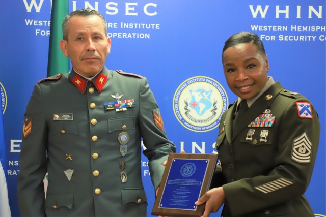 Army University Senior Enlisted Advisor, U.S. Army CSM Faith Alexander, presents Chilean Army Sub Official Mayor (SGM) José Guillermo Letelier Águila the Senior Enlisted Advisor Course 2021 Leadership Award. 