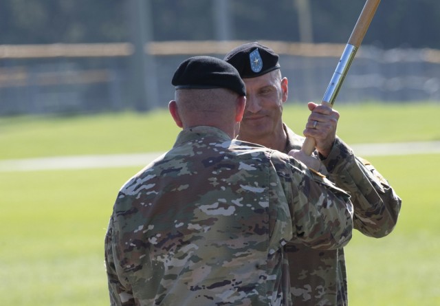 Brig. Gen. Patrick R. Michaelis, Fort Jackson commander, takes the post colors from Maj. Gen. Lonnie Hibbard, command of the Center for Initial Military Training, signifying Michaelis&#39; command of the installation.