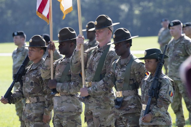 A color guard from the U.S. Army Drill Sergeant Academy marches into position during the Fort Jackson change of command ceremony where Brig. Gen. Patrick R. Michaelis took command of the installation.