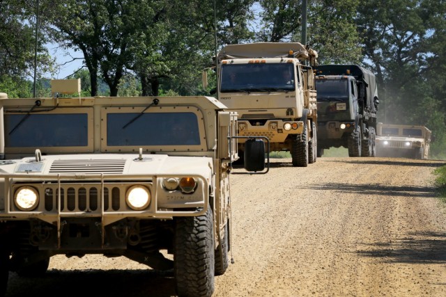 U.S. Army Reserve Soldiers from the 702nd Engineer Company maneuvers tactically through the counter-improvised explosive device training lanes during convoy operations at Fort McCoy, Wis., as part of Warrior Exercise 86-21-02, June 11, 2021. The convoy IED lane tests the Soldiers skills on conducting a convoy and how to react to enemy contact during WAREX. WAREX is an annual training exercise that integrates both combat support and combat service support assets to train United States Army Reserve Soldiers. (U.S. Army Reserve photo by Sgt. Juan F. Jimenez, 364th TPASE)