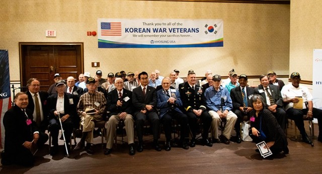 U.S. Army Aviation and Missile Command Commander Maj. Gen. Todd Royar poses with a group of Korean War veterans after the 15th Annual Korean War Veterans Luncheon June 24 at The Summit on Redstone Arsenal, Ala.