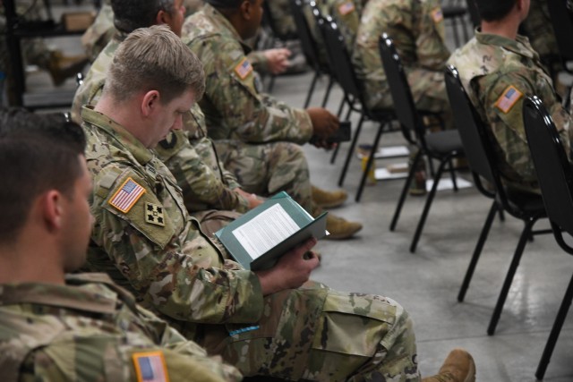 Soldiers from the Utah National Guard’s COVID-19 Task Force stand at attention while a military order is being read at a demobilization award ceremony at Camp Williams, Utah, June 16, 2021. After serving their state and communities for over a...