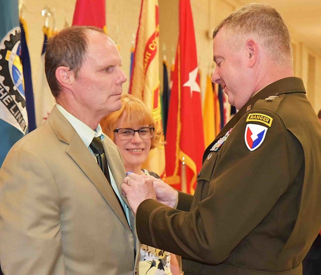 Maj. Gen. Chris Mohan, commanding general, U.S. Army Sustainment Command, and senior mission commander, Rock Island Arsenal, Illinois, awards Michael O’Gara the Civilian Service Achievement Medal during the RIA quarterly retirement ceremony June...