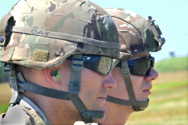 Ammunition Specialist Course students watch delicate sling load operations while awaiting their turn to train at McLaney Drop Zone June 17.