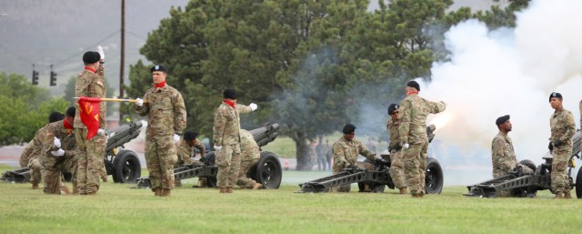 Artillerymen with Battery A, 3rd Battalion, 29th Field Artillery Regiment, 3rd Armored Brigade Combat Team, 4th Infantry Division fire cannons during a change of command ceremony for 2nd Stryker Brigade Combat Team, 4th Inf. Div. June 25, 2021 at Fort Carson, Colo. The change of command ceremony is a time-honored tradition in which the outgoing commander formally transfers their authority to the incoming commander. (U.S. Army photo by Sgt. Gabrielle Pena)