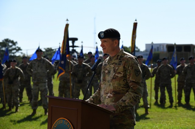 U.S. Army Col. Michael S. Johnson gives remarks just after assuming command of the 110th Aviation Brigade, U.S. Army Aviation Center of Excellence during a change of command ceremony at Fort Rucker, Alabama, June 25, 2021.
