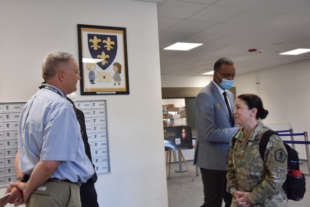 WIESBADEN, Germany—Brig. Gen. Hope C. Rampy, the Army’s Adjutant General, speaks with Chris Pittman, Directorate of Human Resources, during her tour of the post office while James McKee, supervisory postal program specialist, waits for his...