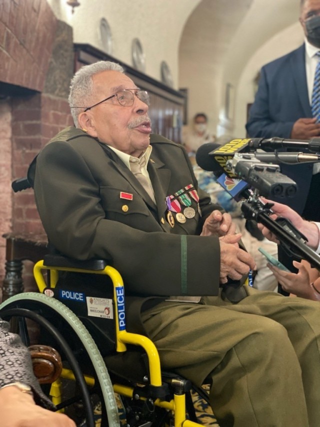 The Chief of Staff of the Army, Gen. James C. McConville, presents the Purple Heart to World War II veteran and life-long New York City resident Mr. Osceola “Ozzie” Fletcher, June 18, 2021 at the Fort Hamilton Community Club here. Press conference was held following ceremony with Mr. Fletcher. Photo Credit: Connie Dillon