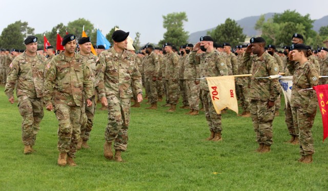 Leadership with 2nd Stryker Brigade Combat Team, 4th Infantry Division, conduct a pass and review led by Maj. Gen. Matthew MacFarlane, commander of 4th Inf. Div. during 2SBCT's change of command ceremony June 25, 2021 at Fort Carson, Colo. The change of command ceremony is a time-honored tradition in which the outgoing commander formally transfers their authority to the incoming commander. (U.S. Army photo by Sgt. Gabrielle Pena)