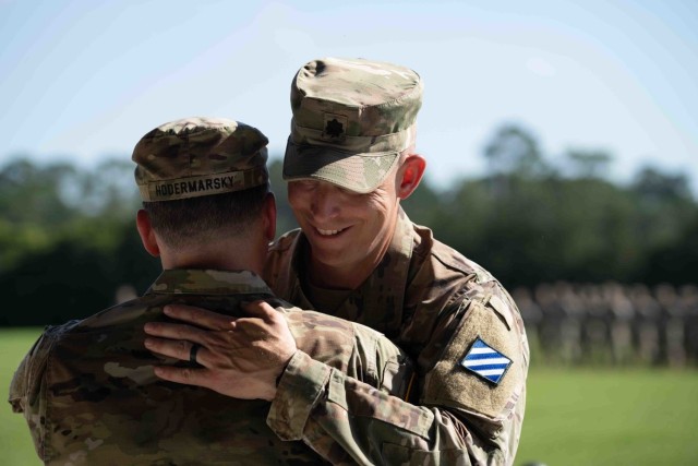 Lt. Col. Steven L. Chadwick, outgoing commander of the 3rd Battalion, 67th Armored Regiment, 2nd Armored Brigade Combat Team, greets Lt. Col. Daniel G. Hodermarsky, incoming commander, after giving his remarks during a change of command ceremony on Cottrell Field at Fort Stewart, Georgia, June 16, 2021. (U.S Army Photo by Spc. Devron Bost)