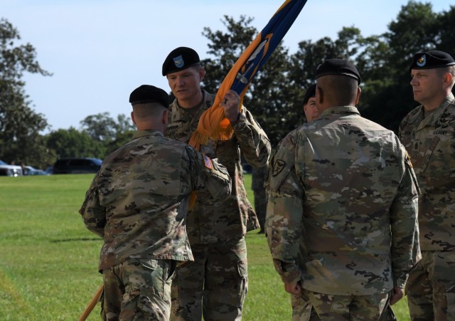 U.S. Army Col. Michael S. Johnson assumes command of the 110th Aviation Brigade, U.S. Army Aviation Center of Excellence, from Col. George Ferido during a change of command ceremony at Fort Rucker, Alabama, June 25, 2021.