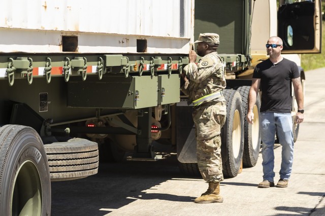 A Soldier from the Alabama Army National Guard’s 781st Transportation Company secures an outbound load destined for Bluegrass Army Depot in Kentucky.