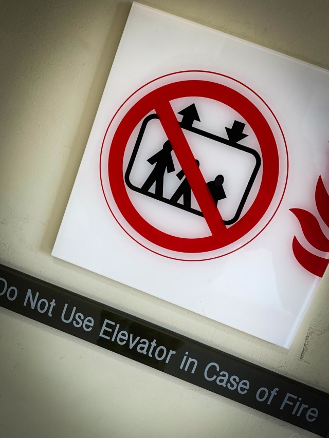 CAMP HUMPHREYS, Republic of Korea - Signs such as this, cautioning Humphreys community members to avoid elevators in the case of a fire emergency, help maintain fire safety throughout Humphreys. The Humphreys Fire Department is targeting reducing the threat of fires from unattended cooking, helping to ensure that the community stays safe and protected.