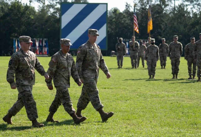 Lt. Col. Daniel G. Hodermarsky, left, incoming commander of the 3rd Battalion, 67th Armored Regiment, 2nd Armored Brigade Combat Team, Col. Terry R. Tillis, middle, commander of the 2nd Armored Brigade Combat Team, 3rd Infantry Division, and Lt....