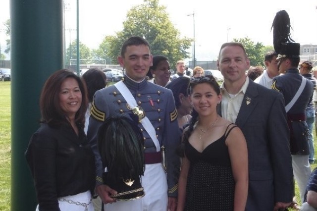 Maj. Donald A. Schmidt II, the executive officer of the 9th Brigade Engineer Battalion, 2nd Armored Brigade Combat Team, 3rd Infantry Division, is with his family after conducting his final parade as a cadet during the U.S. Military Academy's graduation week at West Point, New York, May 2007. The Army is proud of its lesbian, gay, bisexual, transgender or questioning Soldiers who serve with distinction and are role models for exemplifying the Army's highest values. (Courtesy Photo)