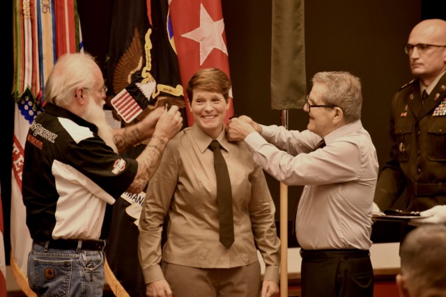 Lt. Gen. Maria Gervais' brother, Robert S. Rea, and father-in-law, Jacq Gervais, pin Maria during her promotion ceremony June 21, 2021.