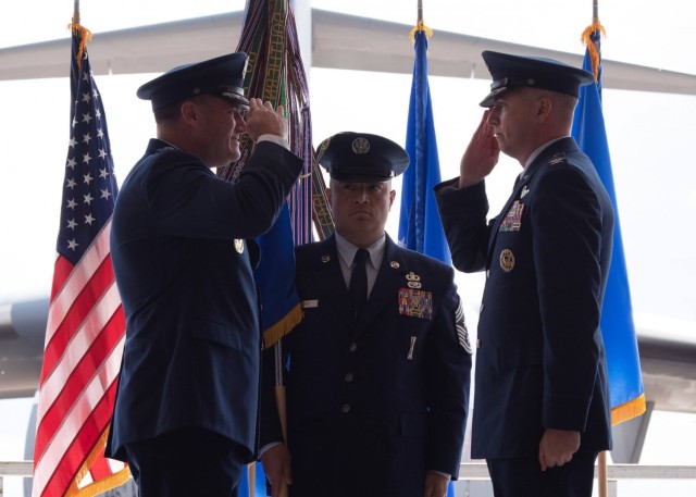 (On right) U.S. Air Force Col. David A. Fazenbaker, 62nd Airlift Wing commander, salutes Maj. Gen. Kenneth T. Bibb Jr., 18th Air Force commander, after taking command of the 62nd AW at Joint Base Lewis-McChord, Washington, June 15, 2021. The 62nd...