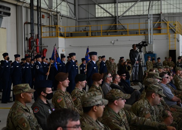 The 62nd Airlift Wing stands at parade rest during the 62 AW change of command ceremony at Joint Base Lewis-McChord, Washington, June 15, 2021. The 62 AW commander ensures the readiness of more than 2,400 active-duty and civilian personnel along with 40 permanently assigned C-17 Globemaster III aircraft to support worldwide combat and humanitarian airlift and airdrop operations. (U.S. Air Force photo by Airman 1st Class Callie Norton)