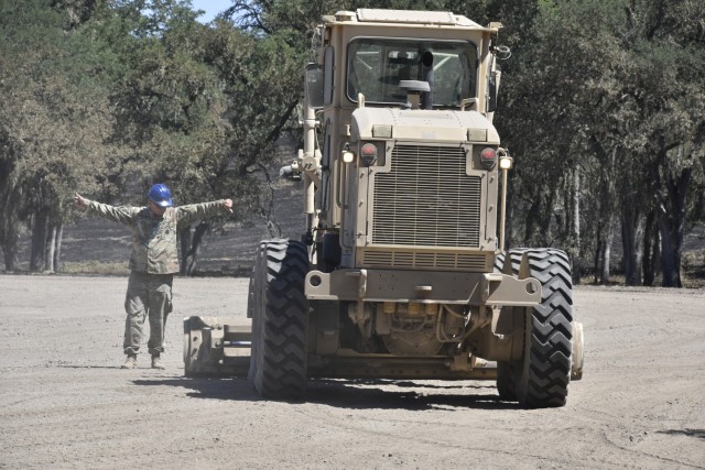 The 471st Engineer Company out of Fort Buchanan, Puerto Rico trains for an upcoming deployment with the 80th Training Command schoolhouse at Fort Hunter Liggett, California, June 11, 2021. Because the unit was lacking in needed training support and equipment in their home station, FHL agreed on short notice to train them, including the 45 12N (heavy equipment operator-construction engineer) Soldiers, in addition to the regular schoolhouse students. The 471st aided FHL in its modernization efforts by completing several troop projects, such as new steps at the Hacienda, 12 acres of bivouac/training area at Training Area 10, a concrete ramp, a sun shelter, and a new parking lot at the Equipment Concentration Site.