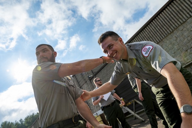 Vincent Klinkner and Matthew Balas, park rangers for the U.S. Army Corps of Engineers Pittsburgh District, train on self-defense tactics at Crooked Creek Lake in Ford City, Pennsylvania, June 15, 2021, as part of a five-day Visitor Assistance...