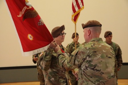 Lt. Col. Meghann Sullivan takes the 5th Battalion, 5th Security Force Assistance Brigade guidon from 5th SFAB Commander, Col. Andrew Watson after its relinquished by outgoing Commander, Col. Rhett Blackmon at Joint Base Lewis McChord, Washington, today.  Sullivan becomes the first women to take command of an SFAB battalion in the enterprise's four-year history.