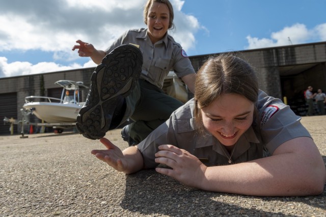 Paige Lupyan slips out of the grasp of Elizabeth Mayo, park rangers with the U.S. Army Corps of Engineers Pittsburgh District, during training on self defense and protective tactics at Crooked Creek Lake in Ford City, Pennsylvania, June 15, 2021,...