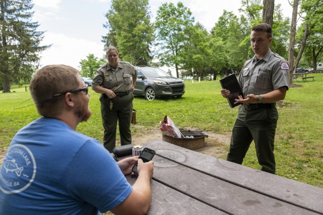 Matthew Balas and Karen Osler, park rangers from the U.S. Army Corps of Engineers Pittsburgh District, respond to a noise complaint at a campground during a training scenario at Crooked Creek Lake in Ford City, Pennsylvania, June 15, 2021, as part...